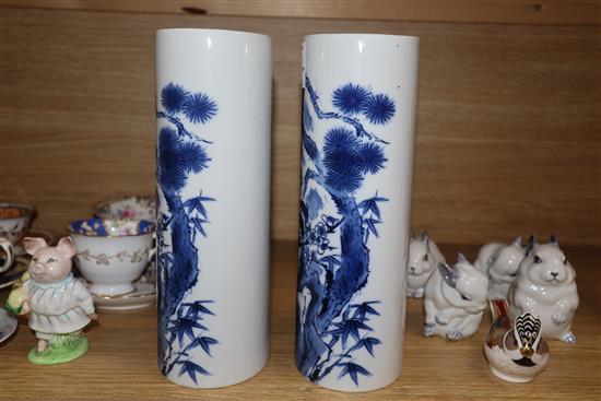 A pair of Chinese blue and white oval section sleeve vases height 25cm (one a.f.)